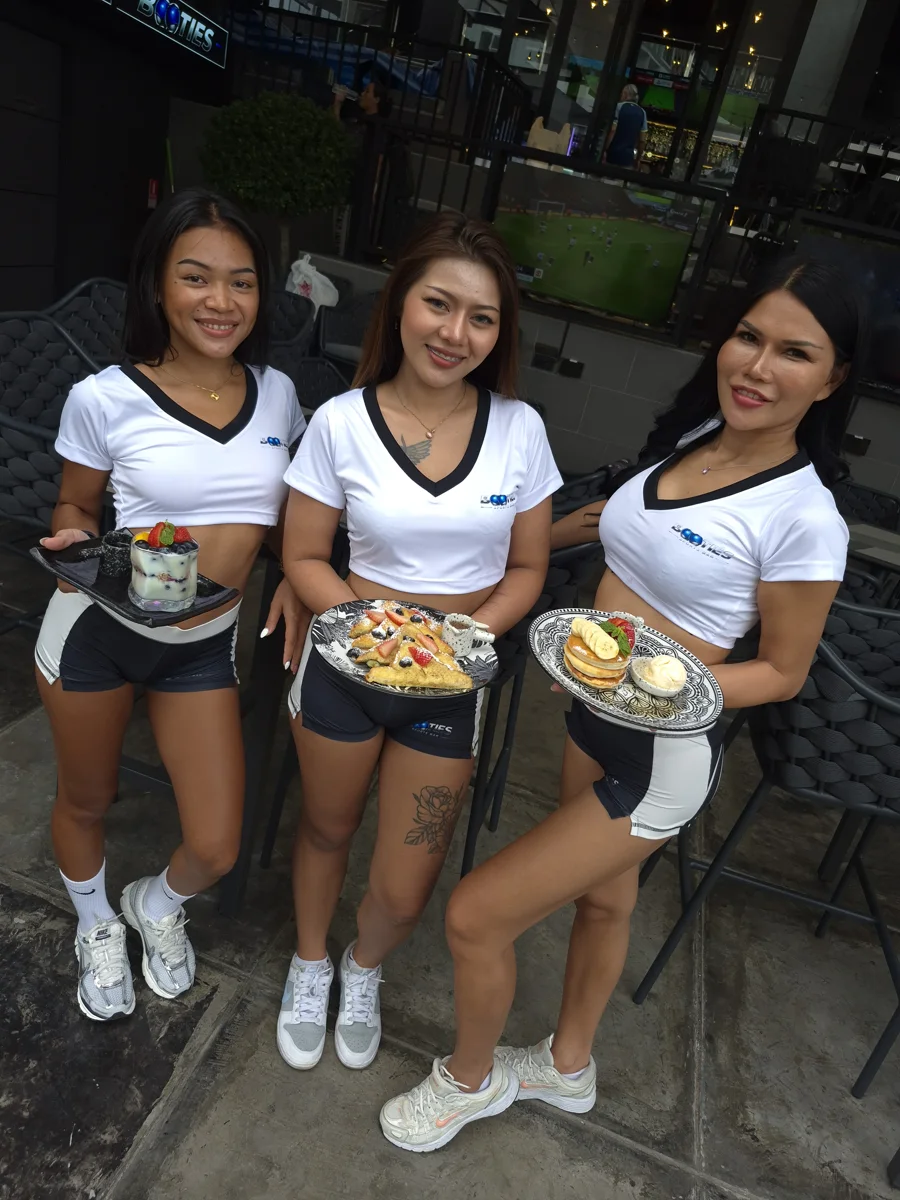 The Booties team presenting food outside the sports bar in Pattaya